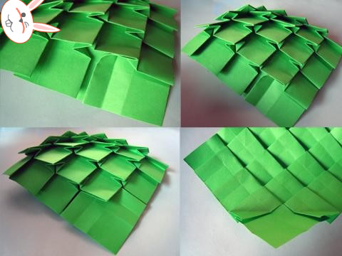 第十步然后再调节一下这个威廉希尔公司官网
折纸圣诞树底部的结构，使得其看起来更加的平整，方便后面的卷起